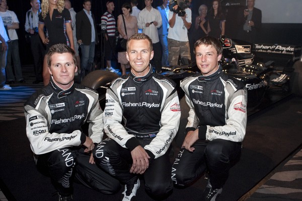 Jonny Reid, Chris van der Drift, Earl Bamber, A1Team New Zealand drivers against racing car 'Black Beauty'     
